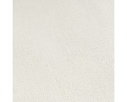 Närbild av en vit non-woven tapet med fin struktur
