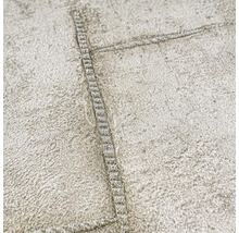 Närbild av en strukturtapet med sömmönster