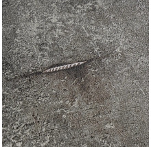 Närbild av en grå yta med en repa