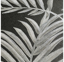 Närbild av en strukturerad tapet med bladmotiv