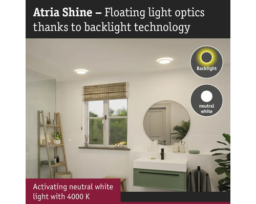 Modernt badrum med taklampor med bakgrundsbelysning, handfat och spegel