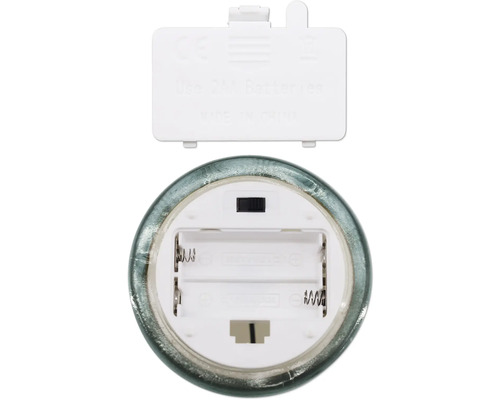 Batterifack för ett ljus med instruktioner för användning av två AA-batterier