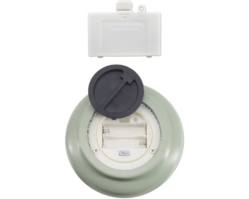 Batterifack på en lampa med öppet lock