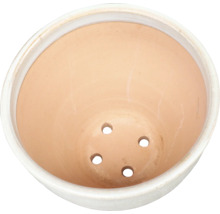 Innerutsikt av en blomkruka med dräneringshål