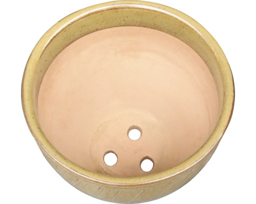 Keramisk blomkruka med tre hål för dränering