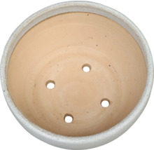 Blomkruka med dräneringshål