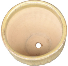 Keramisk blomkruka med dräneringshål, ovanifrån