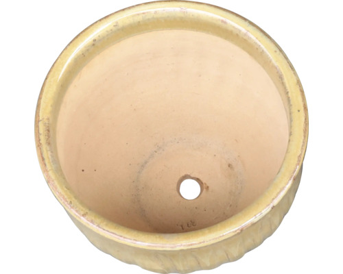 Keramisk blomkruka med dräneringshål, ovanifrån