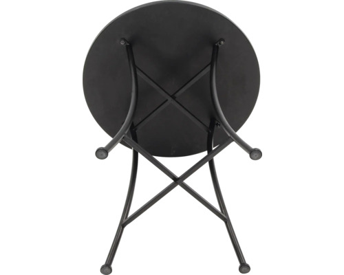 Vy över ett runt, svart trädgårdsbord med metallram.