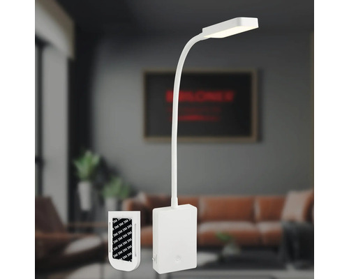 Vit LED-bordslampa med flexibel arm och självhäftande remsor för montering.