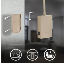 Fästning av ett trådlöst uttag med tejp på väggen