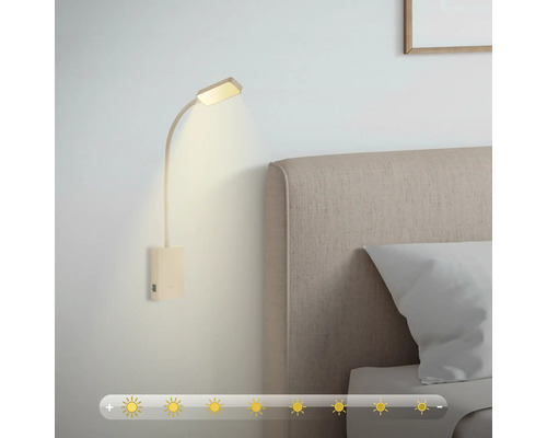 Vägglampa med justerbar ljusstyrka bredvid en säng