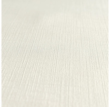 Närbild av en ljus, texturerad tapet.