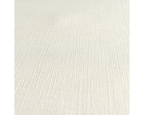 Närbild av en ljus, texturerad tapet.