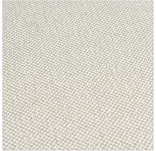 Närbild av en ljusfärgad textilvägg med en fin struktur