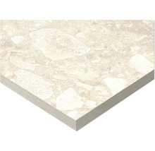 Detalj av en beige golvplatta med stenmönster