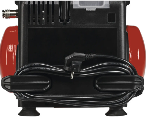 Bakifrån av en röd och svart kompressor med kabel