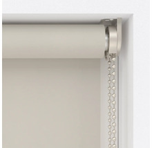 Detaljvy av en rullgardin med kedjedrag för fönsterdekoration