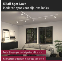 URail Spot Luxe skensystem med flera spotlights i ett vardagsrum.
