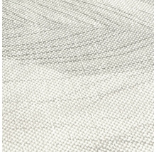 Närbild av ett textilmaterial med fin vävstruktur