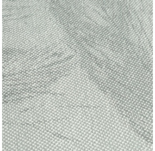 Närbild av en grå textiltapet med prickigt mönster