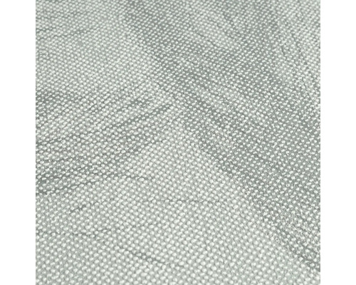 Närbild av en grå textiltapet med prickigt mönster