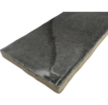 Grå keramisk platta i liggande format