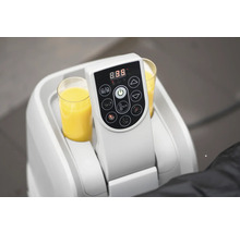 Elektrisk dryckesvärmare med två glas apelsinjuice