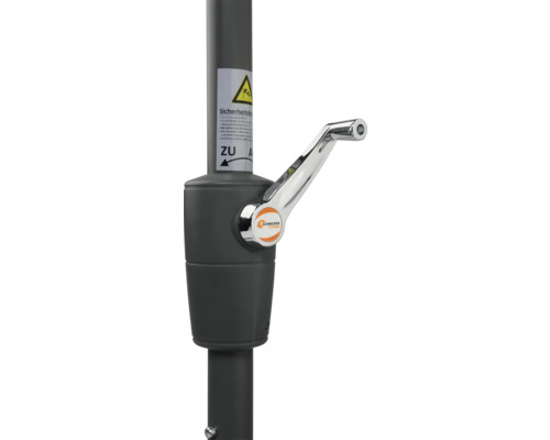 Vevmekanism för ett parasoll med säkerhetsanvisningar och Schneider Schirme-logotyp