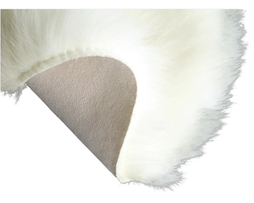 Detaljbild av en matta med konstgjord päls