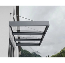 Modern entrétak av glas med antracitgrå aluminiumram, monterat på en yttervägg med dragstänger.