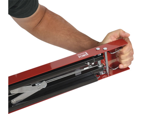 Person som använder laststabiliseringsstång