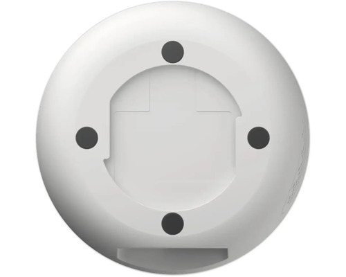 Undersida av en rund, vit enhet med fyra monteringspunkter