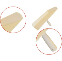 Plastspackel med handtag för bearbetning av spackel