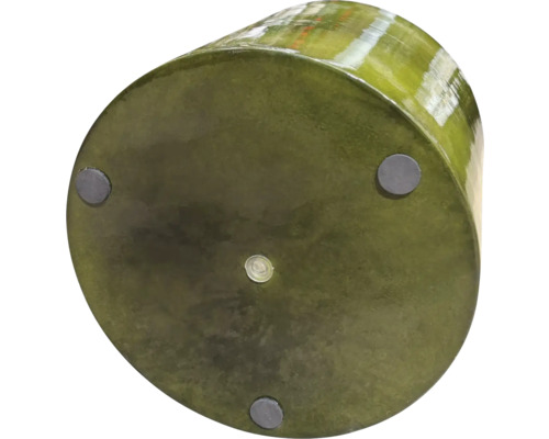 Undersidan av en rund planteringskruka med fötter