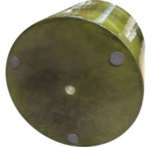 Undersida av en rund blomkruka med fötter