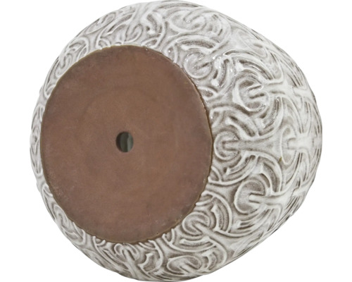 Blomkruka med ornament och dräneringshål i botten