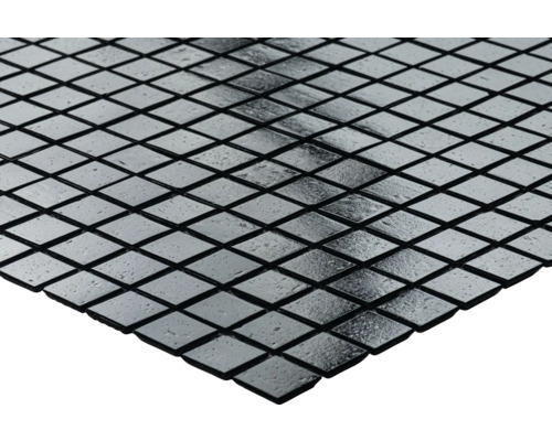 Mosaikplattor med kvadratiska, speglade element.