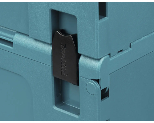 Detaljvy av ett låsspänne på Makita MAKPAC verktygsväska med Makita Logo.