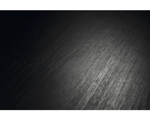 Mörk mönstrad yta i trälook, närbild av en laminatplanka eller ett golv.