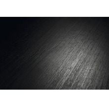 Mörk mönstrad yta i trälook, närbild av en laminatplanka eller ett golv.