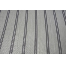 Närbild på ett vävt tyg med vertikalt randigt mönster.