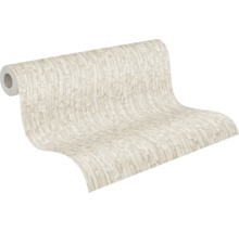 Non-woventapet med stenlook i ljusbeige, strukturerad yta, tapetrulle.