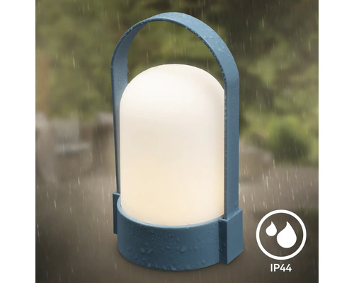 Bärbar LED-utomhuslampa i blått med handtag och vit ljuskropp, stänkvattenskyddad enligt IP44 för utomhusbruk.