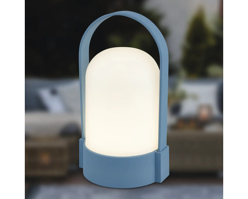 Blå bärbar LED-utomhuslampa med vit rundad skärm och bärhandtag.