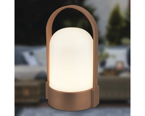 Bärbar LED-lampa för utomhusbruk med handtag, varmvitt lysande cylinder med rundad ovansida och bronsfärgat hölje.