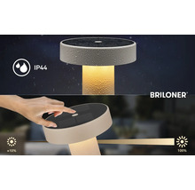 Briloner solcellsbordslampa med IP44 stänkvattenskydd och touch-dimmerfunktion från circa 10 till 100 procent. Briloner Logo.