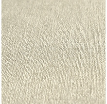 Närbild av en beige non-woventapet med en fin, kornig strukturyta.