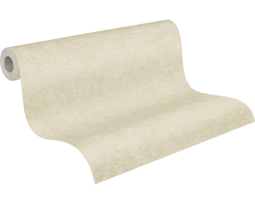Strukturerad non-woventapet i beige, enfärgad, delvis utrullad.