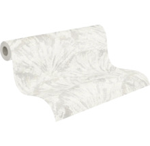 Nonwoven-tapet med abstrakt bladmotiv i ljusa toner, lätt strukturerad.
